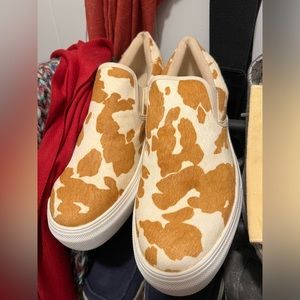 Brand new size women’s 10 slip on cow print shoes